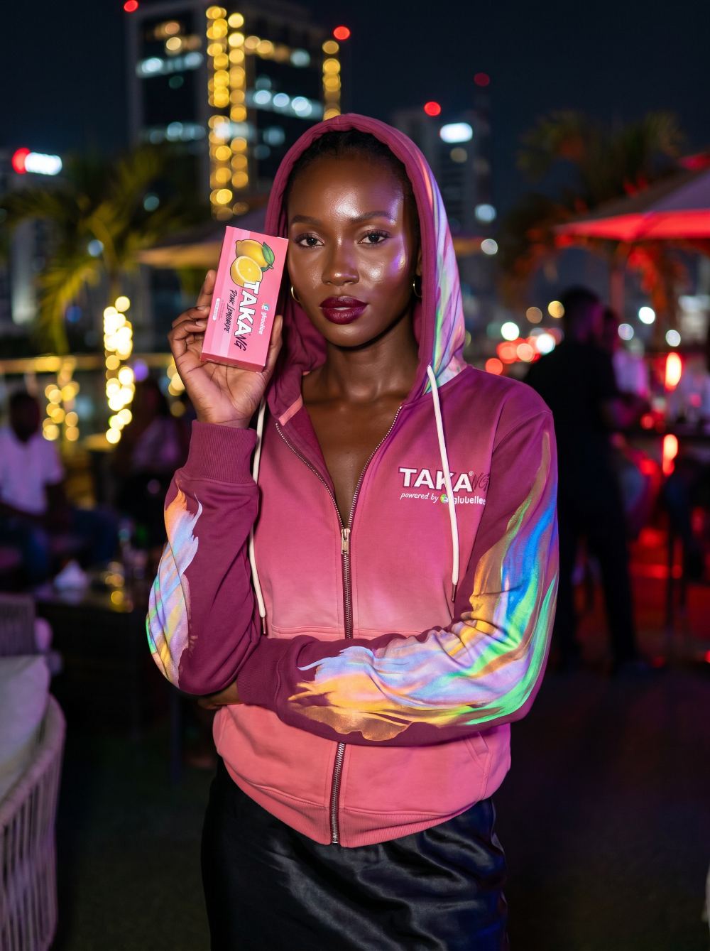TAKA NG ambassador with TAKA Pink Lemonade at night