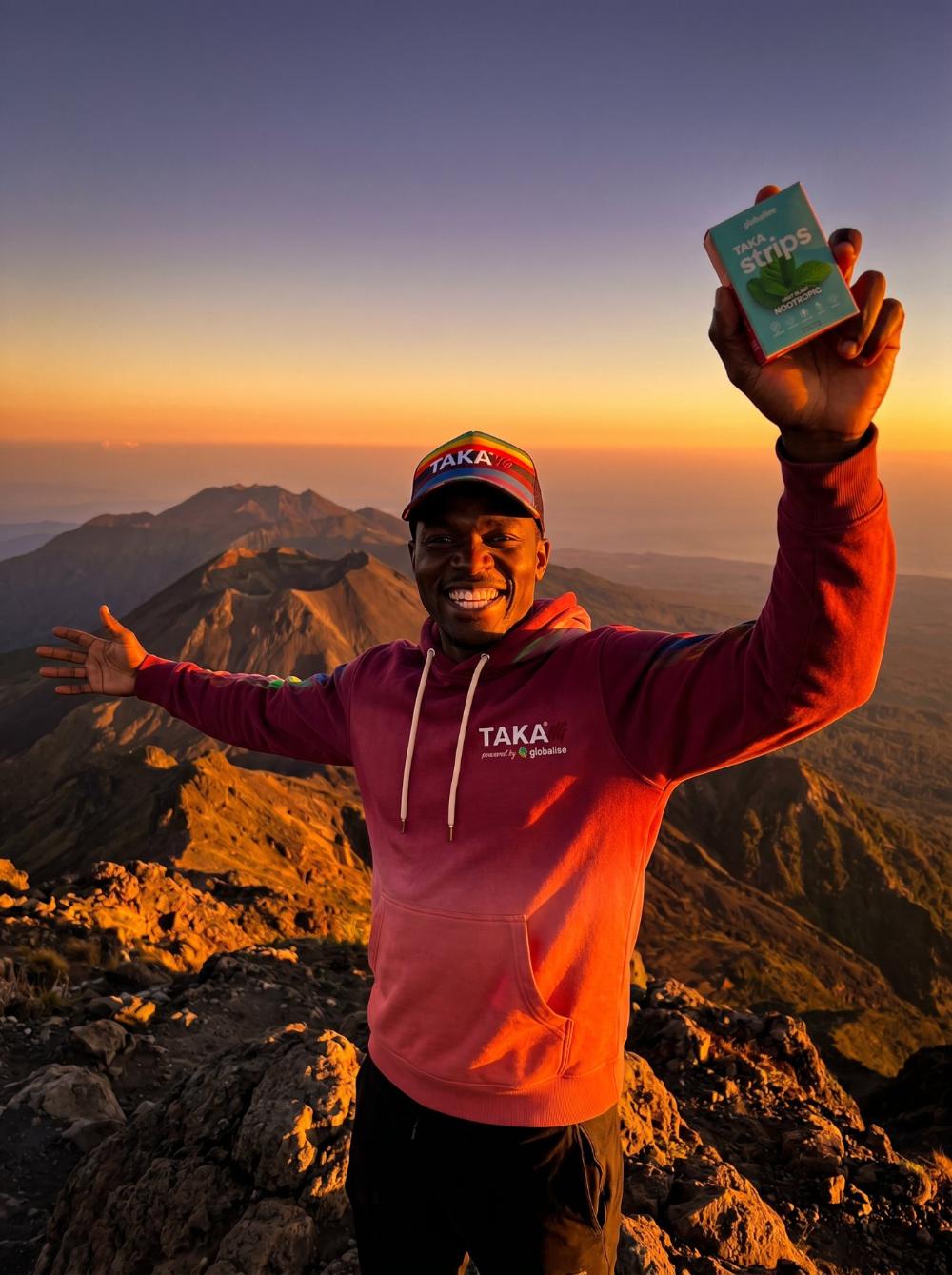 TAKA Strips held up at sunrise on a mountain summit